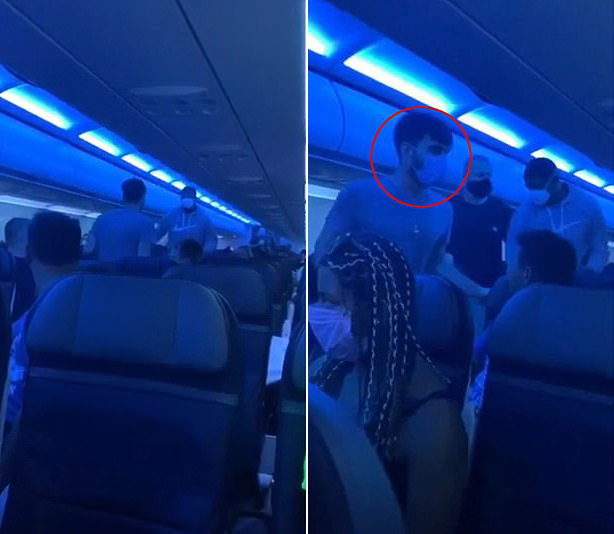 문제의 남성을 제압하기 위해 조심스럽게 다가가는 두 승객의 모습.