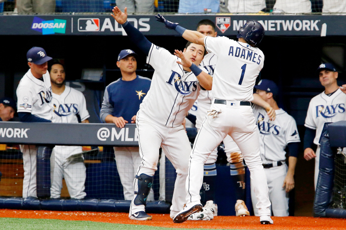 Oct 7, 2019; St. Petersburg, FL, USA; Tampa Bay Rays shortstop Willy Adames (1) celebrates his home run against the Houston Astros with first baseman Ji-Man Choi (26) during the sixth inning in game three of the 2019 ALDS playoff baseball series at Tropicana Field. Mandatory Credit: Reinhold Matay-USA TODAY Sports