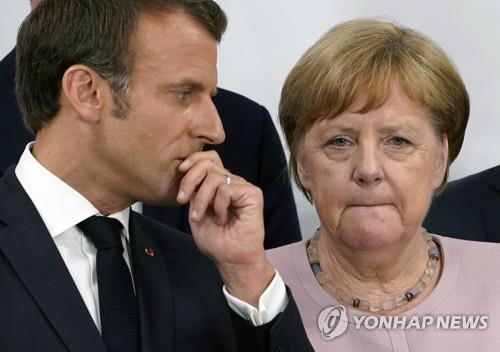 지난 6월 일본 오사카에서 열린 주요 20개국(G20) 정상회의에서 나란히 선 앙겔라 메르켈 독일 총리(오른쪽)과 에마뉘엘 마크롱 프랑스 대통령 [EPA=연합뉴스]