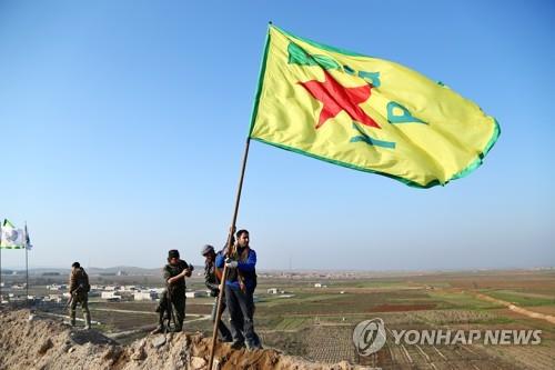 IS 점령지를 탈환한 YPG 대원들 [EPA=연합뉴스]