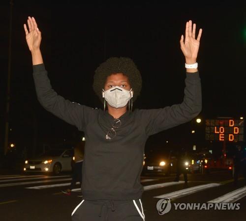 POLICE BRUTALITY PROTESTSeveral hundred demonstrators, organized by Black Lives Matter-LA, converged on downtown Los Angeles to march around the Civic Center, part of a series of national protests on Wednesday, May 27, 2020 to show outrage over the the death of George Floyd, a black man killed Monday after a white Minneapolis police officer pinned him to the ground with his knee. At some point during the march, a group of people broke off and entered the 101 Freeway near Alameda Street, briefly blocking the roadway.   Photo by Jim Ruymen/UPI