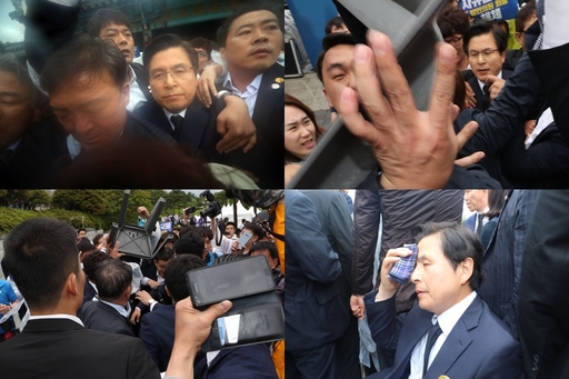 자유한국당 황교안 대표가 18일 오전 제39주년 5·18 민주화운동 기념식이 열린 광주 국립5·18민주묘지에서 행사장으로 입장 하던 중 시민단체의 항의를 받고 있다. 광주=연합뉴스