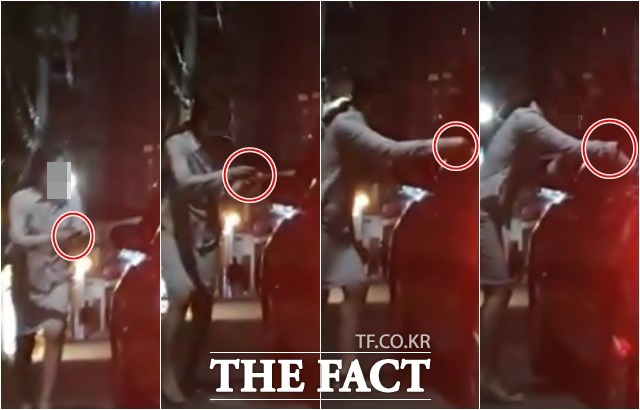 양 원장과 서 국정원장이 함께 식사했던 식당의 주인이 손에 든 택시비를 양 원장이 탄 택시의 운전사에게 건네고 있다./강남=허주열 기자